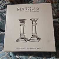 Box of the Waterford Marquis Treviso 6in candlestick pair showing branding and model information.