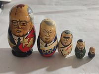 Front view of all five Russian nesting dolls arranged in descending size order