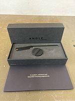 Angle Shaver in black box with foam insert and informational card