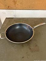 Hexclad frying pan with honeycomb non-stick surface, showing the interior and handles.