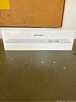 Photo of brand new Apple Magic Keyboard box showing the keyboard layout and packaging.