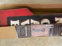 Top view of boxed marquee sign showing part of the label and sign's edge.