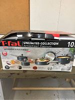 Box of T-fal 10 piece cooking set showing branding and product features.