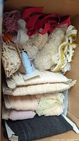 Box with mixed lace trims in various colors including cream, white, red, purple, and pink.