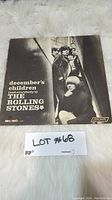 Front cover of The Rolling Stones album December's Children featuring band members and album title.