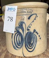 Front view of crock showing hand-painted cobalt decoration and maker’s stamp