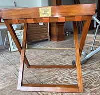 Front view of folding stand holding tray