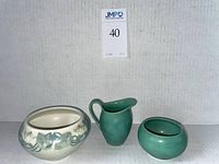 Three pieces displayed front-facing against white background