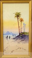 Full view of framed watercolour painting showing the piece under glass in a wooden frame with golden mat.