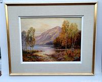 Framed oil painting showing the entire artwork with beige fabric matte and gold frame