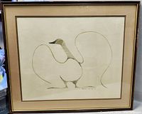 Frontal image of framed lithograph showing the full artwork of a stylized goose with flowing lines and a beige mat inside a gold-tone frame.