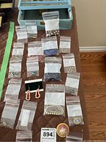 Overview of jewelry box and assorted items laid on table
