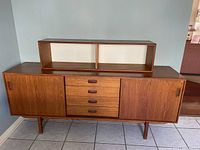 Front view of teak sideboard with removable shelf on top