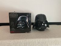 Box alongside assembled helmet front view