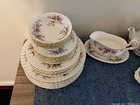 Stacked dinner, dessert and small plates with bowls to show counts and pattern