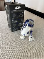 Sphero Star Wars R2-D2 robot with original black packaging box, showing back and side detail.