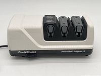 Front view of the Chef's Choice Diamond Hone Sharpener 115 showing the 3 sharpening slots and brand name.