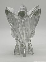 Front view of the clear crystal Lalique Everest vase showing faceted petal design and pointed base extensions.