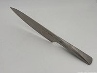 Full-length view showing blade and handle shape and overall condition