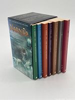 Photo showing the set of seven Chronicles of Narnia books in a slipcase with snowy wolves and Narnia text.