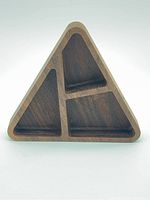 Front view showing the three triangular compartments of the walnut tray