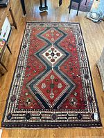 Full top-down view of entire rug laid flat on hardwood floor