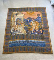 Full view of tapestry laid flat, showing entire design and borders