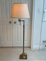 Full front view of assembled lamp showing shade, column and base