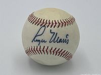 Full view of baseball showing Roger Maris signature on sweet spot and red stitching.