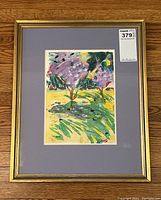 Full view of framed painting showing gold-tone frame and lavender mat.