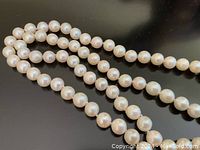 Close-up of pearls showing luster and surface condition