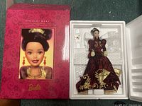 Original pink box labeled Holiday Ball Barbie included in the lot.