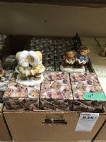 Group view of Cherished Teddies figurines set and original packaging in a cardboard box.