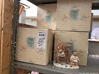 Photo of unopened boxes labeled Cherished Teddies with tag indicating 8 pieces, likely the full set boxed.