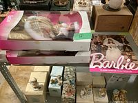 View of two Winter Fantasy Barbie dolls in original pink and white window boxes, dressed in gold and white fur-trimmed gowns, along with the Holiday 2014 Barbie magazine showing cover with a Barbie bride.