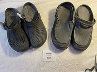 Two pairs of men's Crocs slip-ons side by side showing overall appearance, one with perforations and tags, the other moccasin-style.