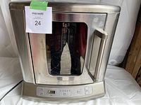 Front view of stainless steel Cuisinart electric roaster oven with glass door and control panel.