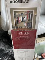 Box front showing ClosetMaid logo, product name, expandable size from 5 ft to 8 ft, and image of installed closet organizer.