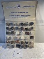 Full view of the unopened Geological Survey of Canada Prospector's Set of Mineral Chips with all 35 mineral samples visible in plastic compartments on a cardboard backing.