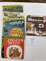 Photo showing the 5 vintage read along books with their records, featuring Disney stories and classic tales. The 101 Dalmatians record is displayed separately.