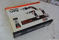 Closed box of Black & Decker VPX power tool set showing graphics of cordless cut saw, screwdriver, and battery.