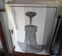 Original packaging showing printed illustration of chandelier silhouette