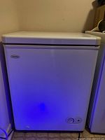 Front view of white Danby chest freezer showing overall condition and size.