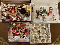 Four boxes of assorted vintage Christmas ornaments including characters, birds, and other shapes