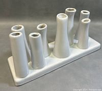 Image showing the front and side angle view of the white multi-tube ceramic vase on rectangular base.