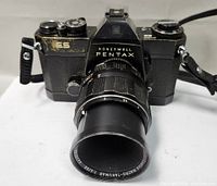 Front view of Honeywell Pentax ES camera with attached Macro-Takumar 1:4/50 lens showing paint wear and lens details.