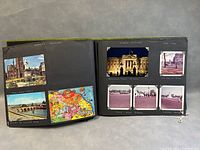 Open photo album spread showing photographs of city landmarks including churches, bridges, and historic buildings with handwritten captions.