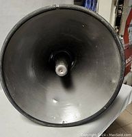 Front interior view of the horn loudspeaker showing dings and the center driver cone.