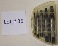 Lot number card alongside the extractor set in plastic case.