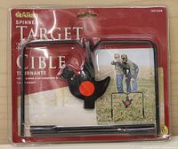 Spinner target in factory sealed blister packaging showing the target and frame with packaging graphics.